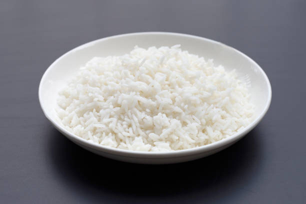 istock Dish of rice on dark background. 1302693256