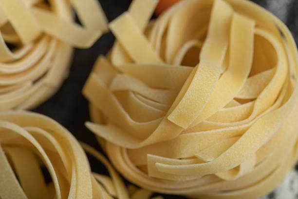 istock Raw nest noodles on a dark background 1302693297
