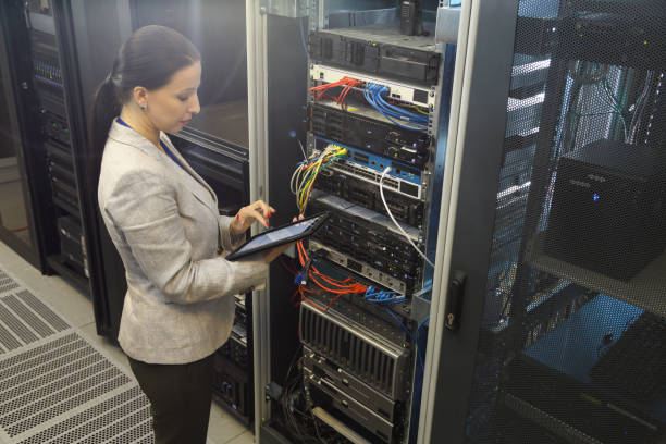 istock Female IT professional in server room 1302693373