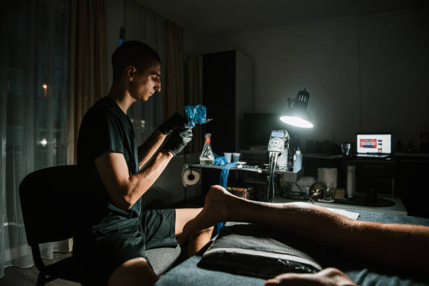 istock Male doing image on leg stock photo 1302694109