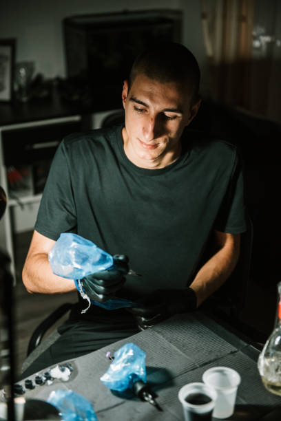 istock Male doing image on leg stock photo 1302694233