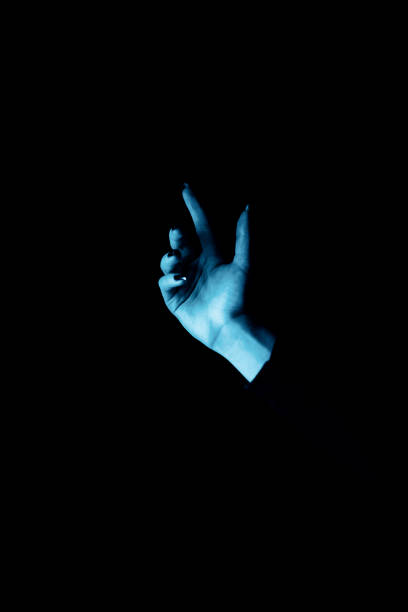 istock Woman hand blue neon lights in background. Space for your text. 1302695255