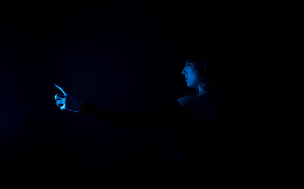 istock Woman blue neon lights in background. Space for your text. 1302695348
