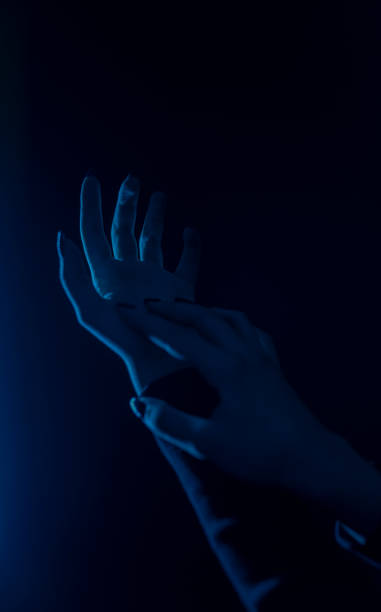 istock Woman hand blue neon lights in background. Space for your text. 1302695350
