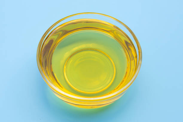 istock Rice bran oil on blue background. 1302695416