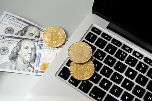 Istanbul, Turkey - February 18, 2021: Close up shot of memorial coins of bitcoin on computer keyboard