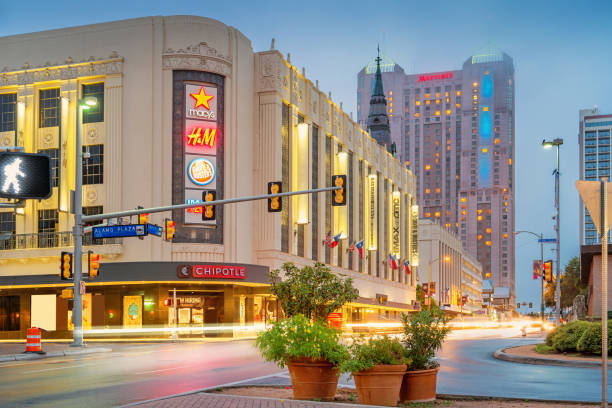 Stock photograph of a shopping street with shopping mall in downtown San Antonio Texas at night.