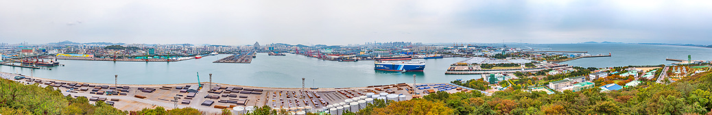 Aerial view of harbor with fishing ships. Famous beach \