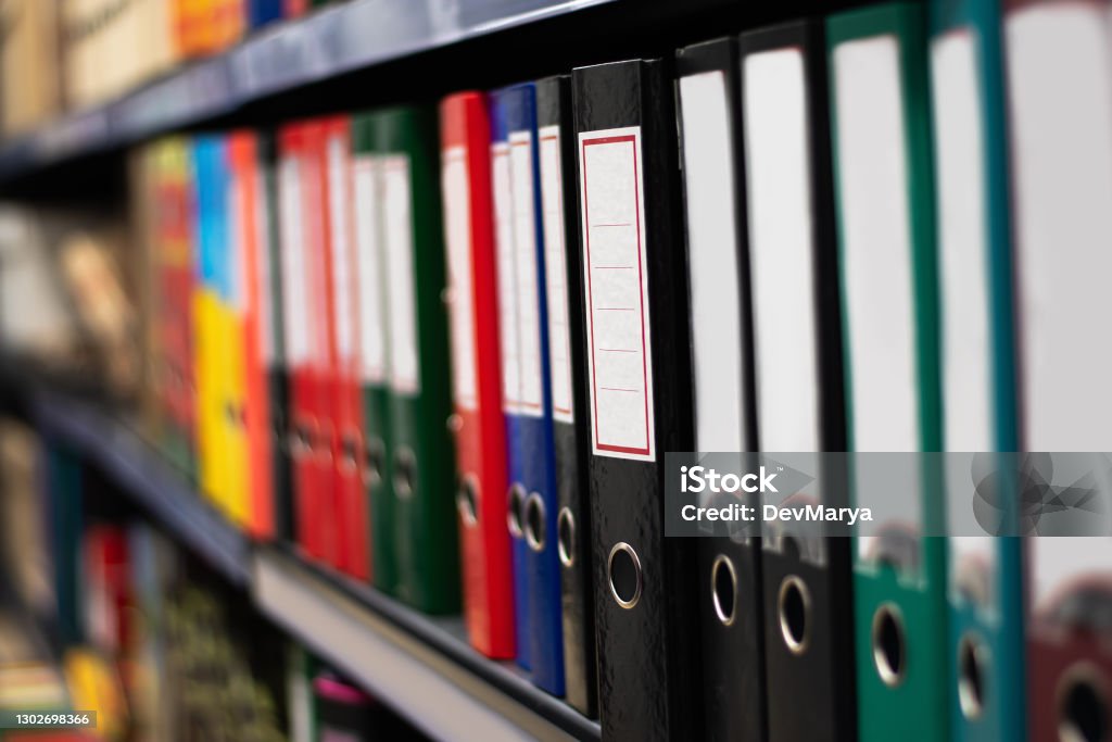 Paper binder shelf in a shop. Binder sale. Multicolor stationery folders. Paper binder shelf in a shop. Binder sale. Multicolor stationery folders Archival Stock Photo