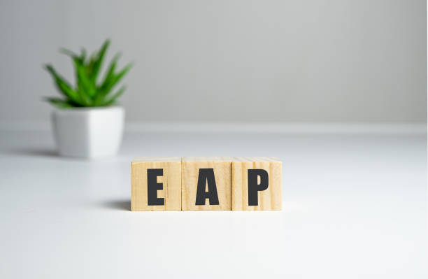 istock Employee assistance program EAP sign on wooden cubes 1302701107