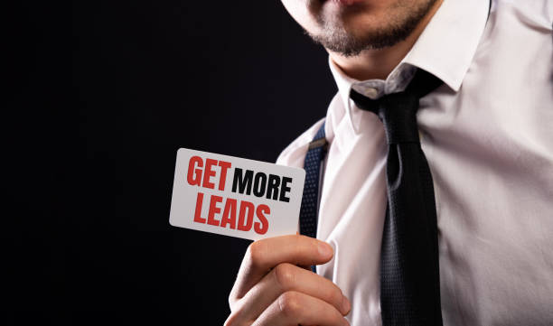 Get more leads card in male hands on black Get more leads card in male hands on black. meme photos stock pictures, royalty-free photos & images