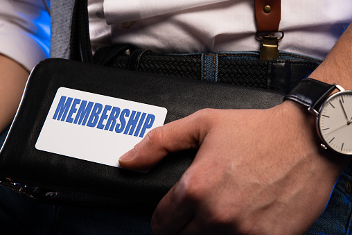 MEMBERSHIP text is written on the card that the businessman. Business concept.