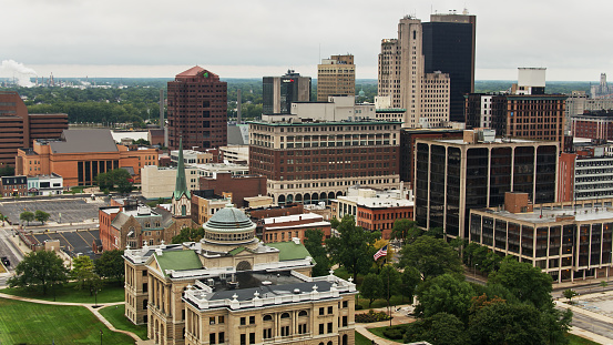 Aerial shot of Toledo, Ohio on a summer morning. The shot includes the Toledo Police department HQ and the Lucas County Courthouse.
