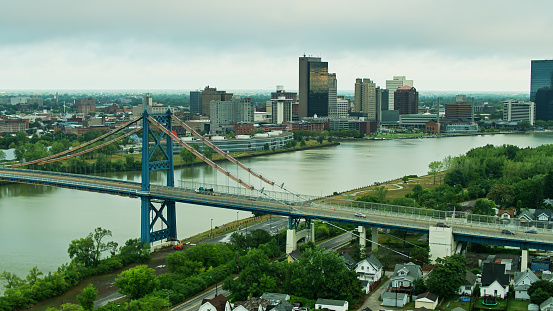 Aerial shot of Toledo, Ohio on a summer morning, taking in the downtown on the banks of the Maumee River, and the Anthony Wayne Bridge.