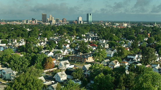 Aerial shot of Toledo, Ohio on a summer morning, looking across single family homes in East Toledo towards downtown.