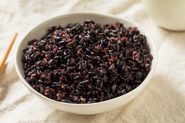 Homemade Cooked Forbidden Purple Rice Homemade Cooked Forbidden Purple Rice in a Bowl jasmine rice stock pictures, royalty-free photos & images