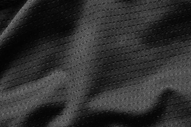 Black sport cloth fabric football shirt jersey texture close up Black sport cloth fabric football shirt jersey texture close up jersey fabric photos stock pictures, royalty-free photos & images