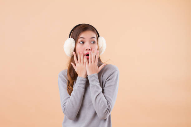 istock excited surprised asian woman looking up 1302708502
