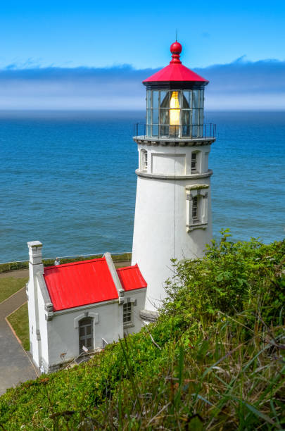 istock Oregon coast lighthouse view from top of hill above 1302708800