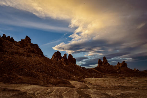 istock Cloudy sunrise desert landscape at Trona Pinnacles rock formations 1302710639