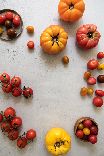 Flat lay with heirloom tomatoes and cherry tomatoes