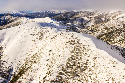 Aerial view of Mt. Hotham Snowy Mountains Victoria Australia, with hazy sky.