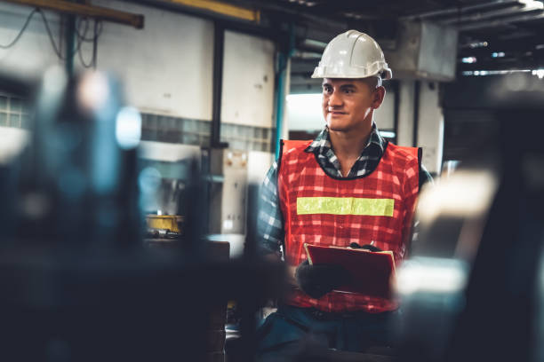 istock Manufacturing worker working with clipboard to do job procedure checklist . 1302718105
