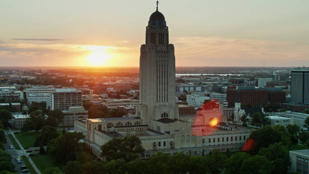 istock Sun Setting Behind Nebraska State Capitol - Aerial 1302719751