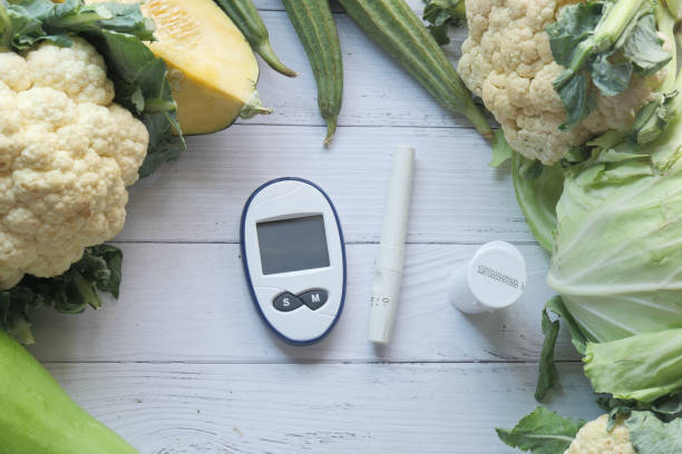 istock diabetic measurement tools and fresh vegetable on table 1302720451