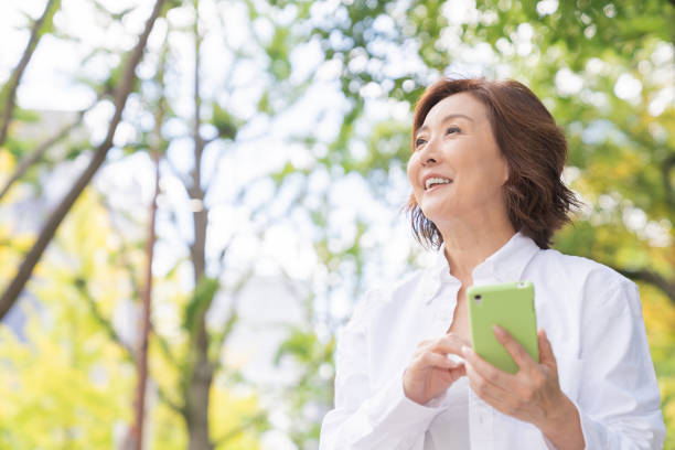 istock senior age woman who uses smart phone 1302720558