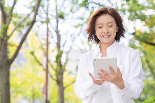 istock senior age woman who uses tablet computer 1302720618