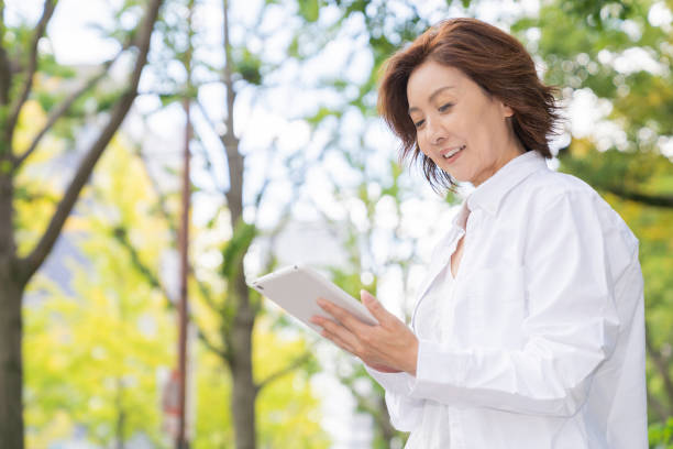 istock senior age woman who uses tablet computer 1302720624
