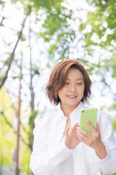 istock senior age woman who uses smart phone 1302720632