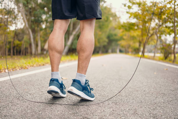 istock man skipping with jump rope in the park. 1302723745