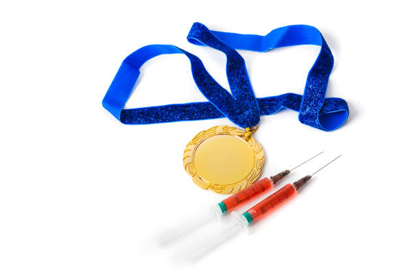 istock Gold medal and syringes 1302723831