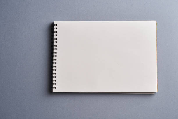 istock sketch book on gray background 1302724795