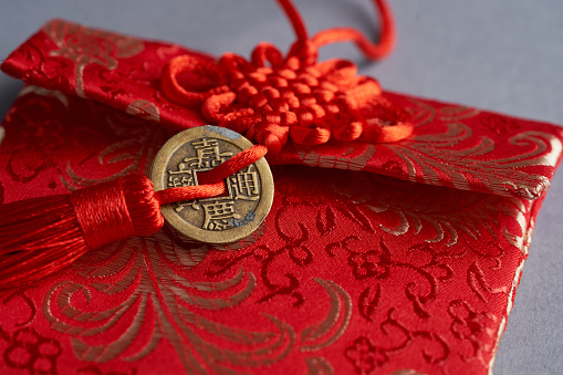 chinese new year lucky bag or red envelope with ancient coin