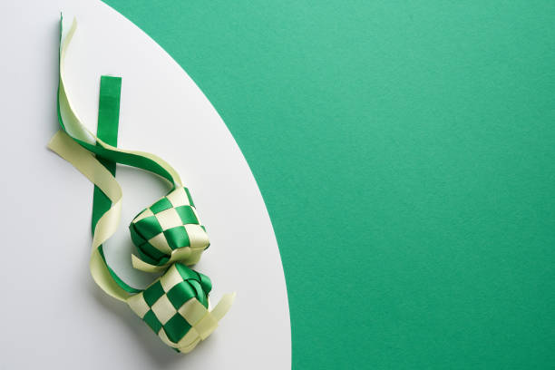 ribbon ketupat on green and white  background