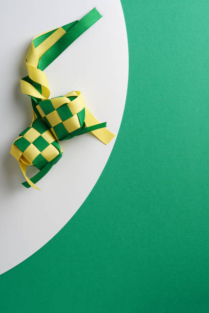 ribbon ketupat on green and white  background