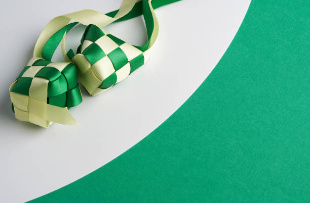istock ribbon ketupat on green and white  background 1302725474
