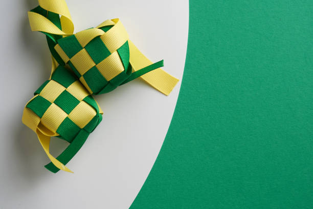 istock ribbon ketupat on green and white  background 1302725702