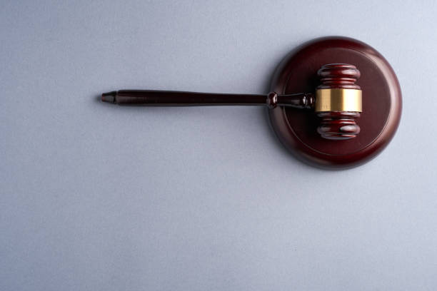 istock Wooden gavel isolated on gray background. 1302725849