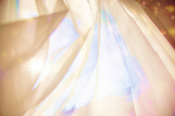 istock Dynamic Translucent curtain background moving in the wind with vivacious pastel colors 1302728676