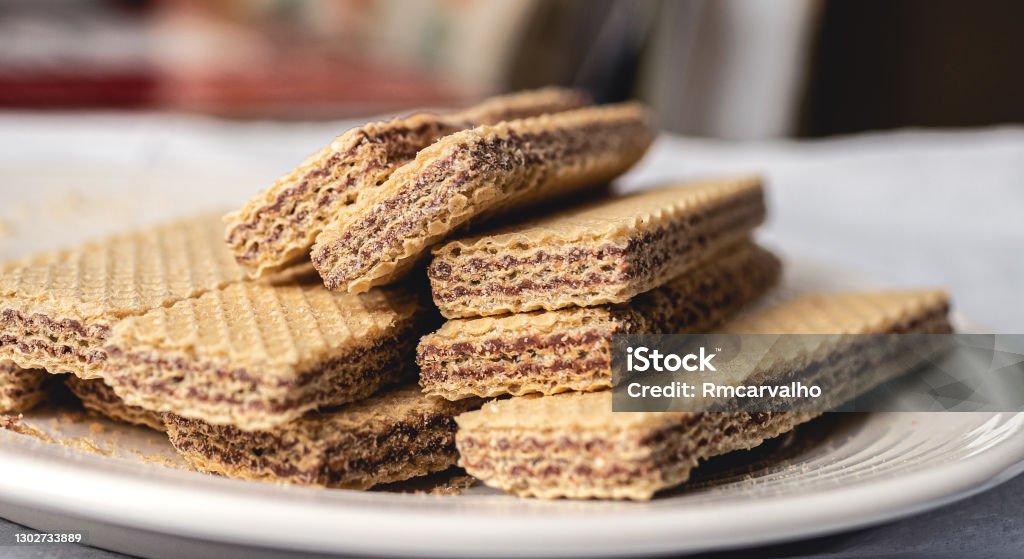 Wafer with cocholate on a white plate. Food, Dessert, Sweet, Crunchy, Tasty. Cookie Stock Photo