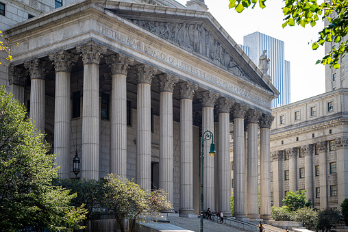 New York City, NY, USA - September 17, 2015: Manhattan, the New York State Supreme Court Building with a frieze bearing the inscription \