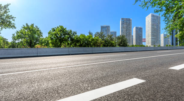 istock Empty road and modern city skyline with buildings in Beijing. 1302739646