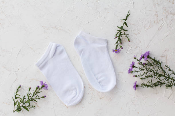 istock Pair of women socks on white background. 1302740383
