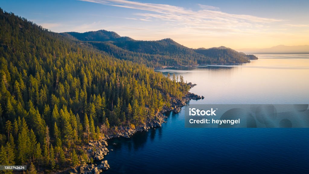 Aerial View of Lake Tahoe Shoreline with Mountains and Turquoise Blue Waters Aerial View of Lake Tahoe Mountains and Turquoise Blue Water, California, USA Landscape - Scenery Stock Photo