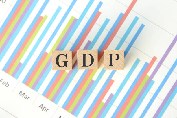 istock Wooden blocks with GDP words on business chart 1302742788