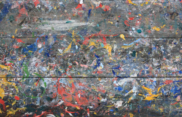 istock Abstract colorful texture background. Splash acrylic color on wood table. 1302743060